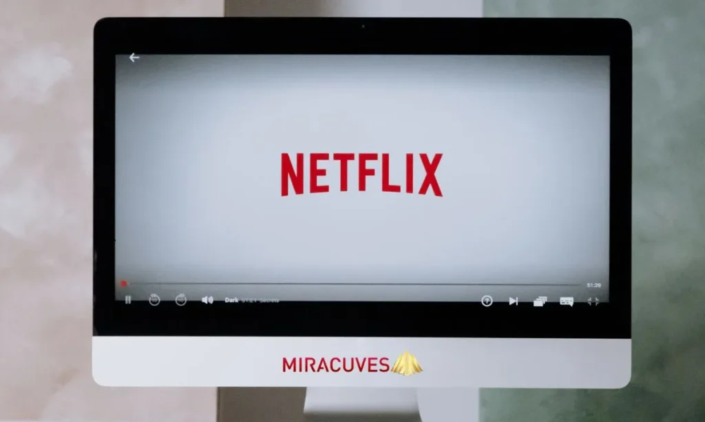 Netflix logo on screen of desktop monitor, showcasing how Miracuves builds next-gen streaming platforms inspired by industry leaders.