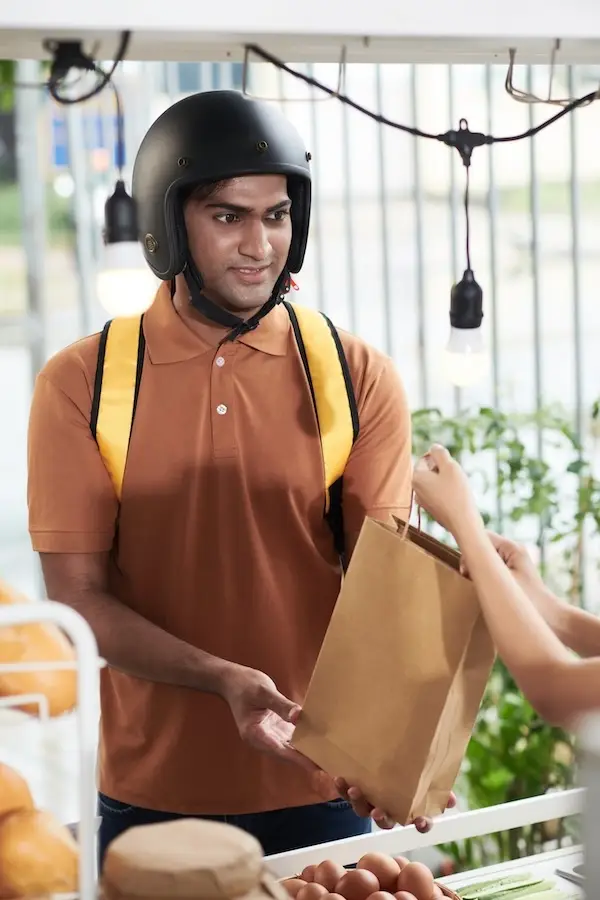 Courier Taking Order in Cafe
