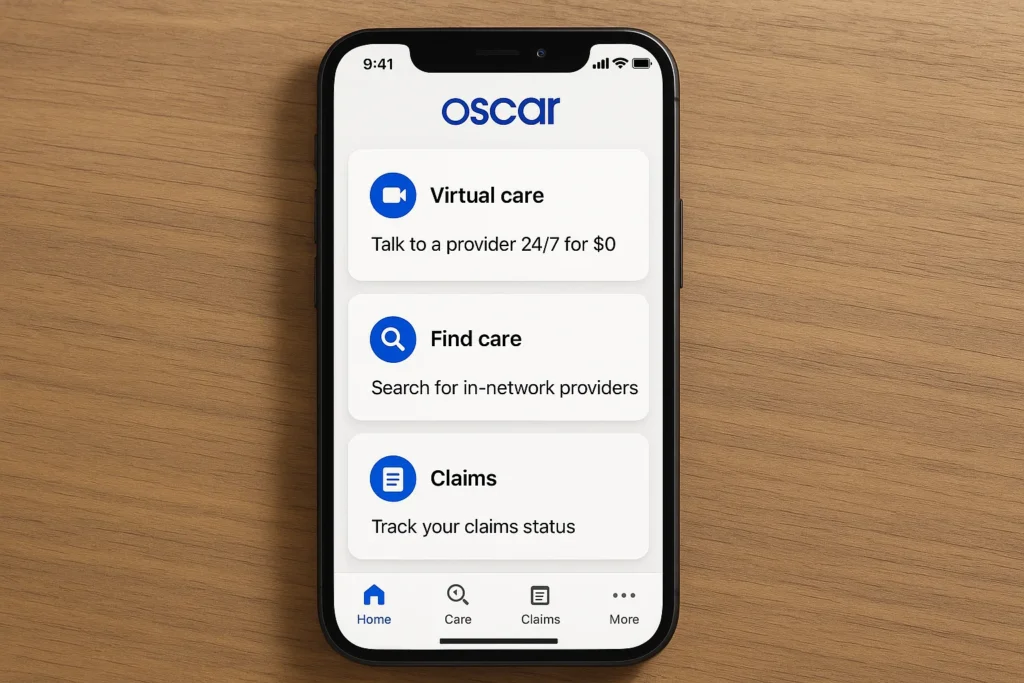 Mobile screenshot of the Oscar Health insurance app showing three main options on the home screen: “Virtual care” with 24/7 provider access for $0, “Find care” for searching in-network doctors, and “Claims” to track claim status. The interface uses clean white cards with blue icons, displayed on an iPhone placed on a wooden desk surface. The bottom navigation includes Home, Care, Claims, and More, reflecting Oscar’s digital-first health management platform.